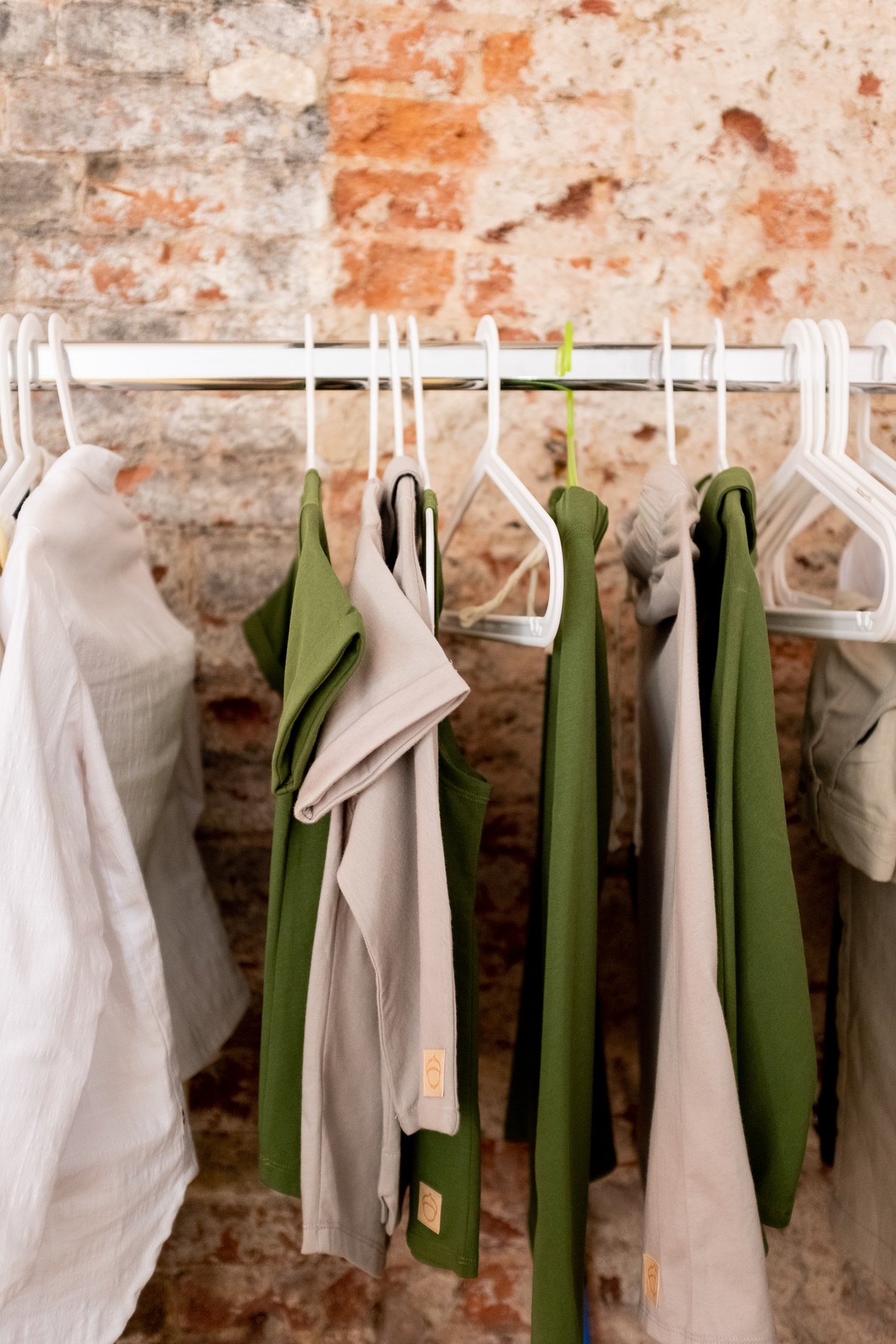 White Tank Top on Green Textile